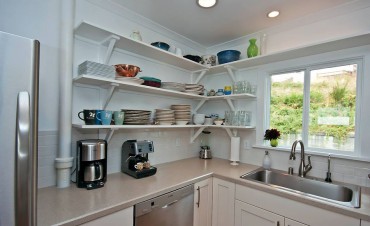 The old, tiny kitchen area beautifully remodeled.