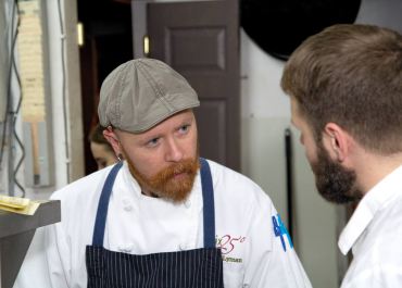 Chef Thad Lyman discussing evening preparations for dinner