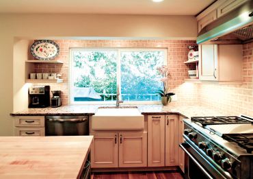 Country-style cabinetry with painted and glazed finish (Photo courtesy A Kitchen That Works)