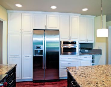 Traditional-style cabinetry with painted finish. (Photo courtesy A Kitchen That Works)