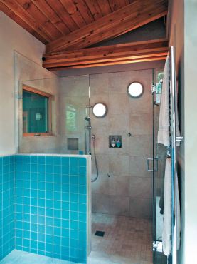 The fixtures featured in this shower were designed for the outdoors. The car decking on the ceiling necessitated wall mounting the fixtures in the shower. (Photo courtesy A Kitchen That Works, LLC)