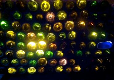 This is our "recycled wine bottle wall," all lit up at the base of our deck/patio stairs.