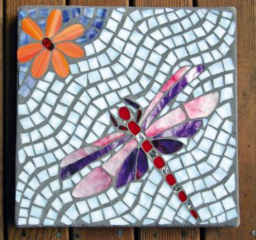 Delightful dragonfly stepping stone was a gift to the author from Louise Martin.