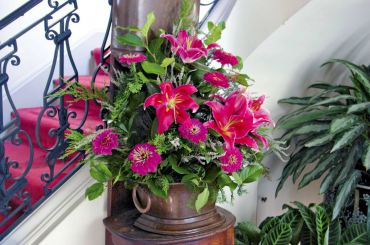 An elegant summertime display features fragrant oriental lilies, zinnias, salal, heather and cedar.