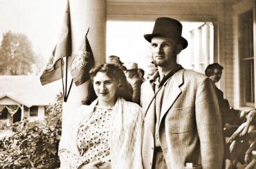 Lorene and Henry stand on the front porch of the Puget Hotel for the centennial celebration in Port Gamble. Henry was known to many in town as "Hank" but not to Lorene. Lorene, who taught herself how to knit, only used "hank" when she referred to yarn. "It's a hank of yarn or a skein of yarn, not my husband," she says.