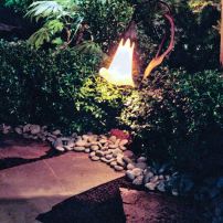 Landscape lighting illuminates pathways for moonlight strolls through the garden.