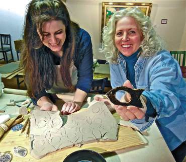 Jessica Loescher and Terry Logan sharing clay and napkin ring techniques.