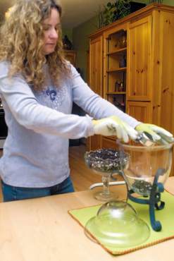 Colleen Miko, "The Creative Gardener," plants a terrarium.