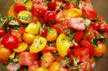 Cherry tomato bruschetta: tomatoes, basil, olive oil, balsamic vinegar, salt, pepper and (sometimes) garlic