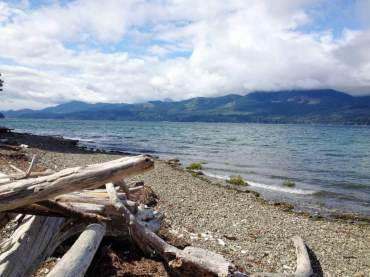 The beach at Guillemot Cove Nature Reserve, which is owned by Kitsap County, can be accessed through one of the trails and has beautiful views of "the Brothers." (Photo by Rodika Tollefson)