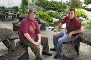 Angus J. McDonald (left) and Scott C. Claflin, co-owners of 12 Trees Cafe & Catering in Poulsbo, serve organic coffee at their location.