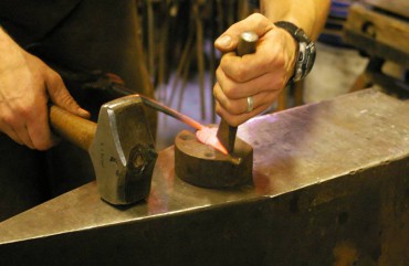 Burnett creates delicate veining on a leaf using a cross-peen hammer.