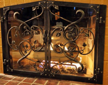 Fireplace screens and doors are a natural place for custom iron work.