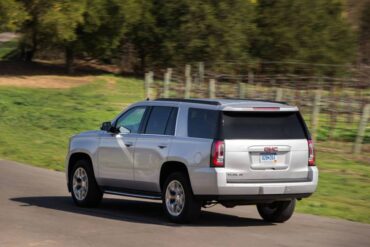 The 2015 GMC Yukon has three rows of seating, but it's shorter than the Yukon XL.