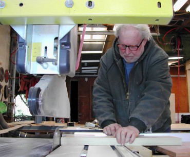 John Steiner in his woodworking shop on South Beach (Rich Passage)