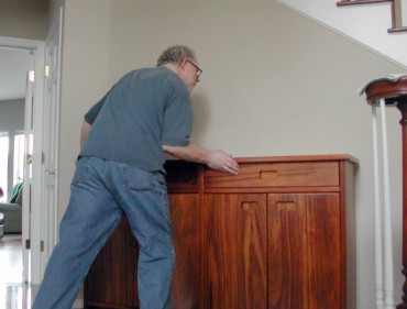 John Steiner delivering an ifilele wood entry hall cabinet