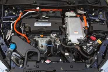 2015 Honda Accord Hybrid Touring engine compartment is jam-packed with a four-cylinder gas engine plus the hybrid electric motor.