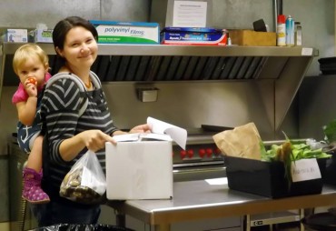 Co-op member Nicole Bothwell (and a helper) picks up her produce.