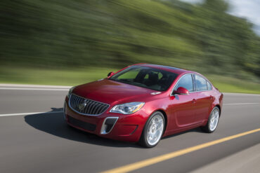 2015 Buick Regal GS in Copper Red Metallic exterior color and equipped with 20”wheels and sunroof.