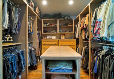 Walk-in closet with island — design by A Kitchen That Works LLC (Photo courtesy Iklil Gregg)