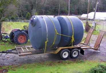 Cisterns arrive at Pheasant Fields Farm for installation. The system was designed by Ken Drexel with the Kitsap Conservation District in 2010.