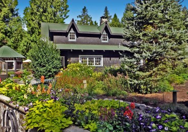 Sitting comfortably in its surrounds as if built decades ago, the Fortner home is the centerpiece in a compound of buildings surrounded by gardens. The bake house is to the left of the main house.