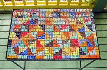 This quilt-patterned table was a gift from Martin to her sister, Kate.