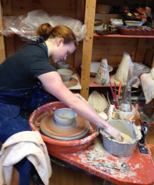 Amy Barkauskas at the potter's wheel