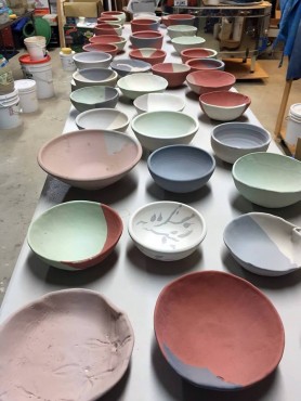 Glazed bowls ready for the kiln