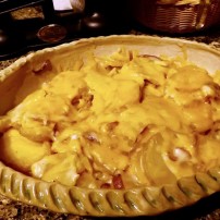 Scalloped potatoes topped with cheese, hot from the microwave and ready to serve!