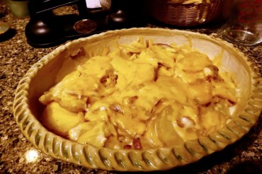 Scalloped potatoes topped with cheese, hot from the microwave and ready to serve!