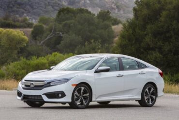 The 2016 Honda Civic has crisp styling with a wide familial grille and LED headlights.