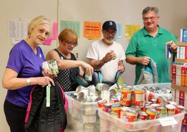 Volunteers in Bremerton packing the backpacks