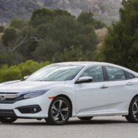 The 2016 Honda Civic has crisp styling with a wide familial grille and LED headlights.