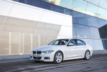 The 2016 BMW 330e looks like any other 3 Series BMW except for the small door in the left front fender.