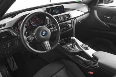 The interior is traditional BMW style, luxury, and high functionality. 