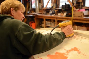 Pat Lapp works on a project as part of the community boat-restoration program for women.