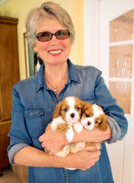 Barbara shows off two puppies.