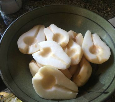 Pears peeled, cut and cored ready to be cooked