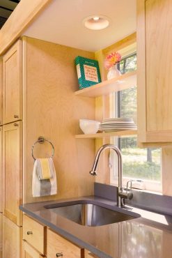 ESCAPE Traveler kitchen pictured with oak cabinets. Cherry or maple cabinets are an available option.