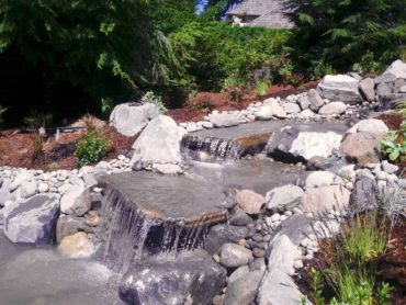 Waterfall installation by Full Throttle Landscaping, using a variety of a variety of flat and round stone from Morrison Gravel (Photo courtesy Mark Stolz)