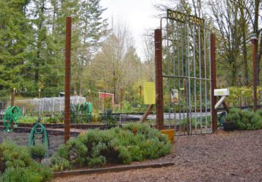 Rock Farm community garden. Cattle guards create a very effective gate, and deer-proof herbs surround the garden.