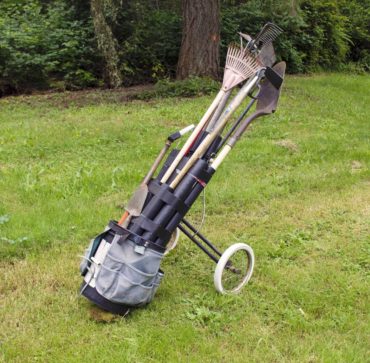 Former golf cart converted to a garden tool cart