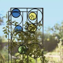 The Kaleidoscope Tomato Cage provides a sturdy support for tomato plants while adding color to the landscape. (Photo courtesy Gardener's Supply Company)