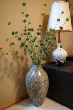 Unique stalks of Jerusalem sage (Phlomis sp.) dry in a tall vase. The flower stalks are woody enough that they don’t need to be hung in order to dry straight. In time, they will turn a mellow-brown tone and will last for many years.