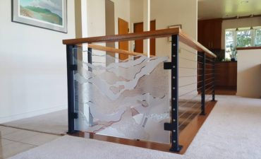 Glass stair rail partition — design by Mark Olson