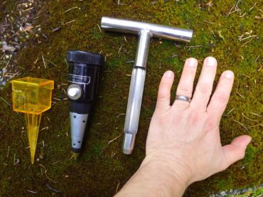 Useful tools for figuring out when to water. From left to right: rain gauge, soil moisture meter, soil auger, your own hand (the best tool!).