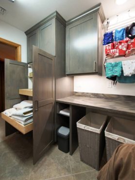 Linen storage, folding space and drying racks were key criteria for this laundry room remodel.