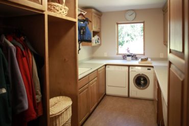 This multitasking laundry room, overlooking the garden, has space for laundry, flower arranging, gift wrapping and more.