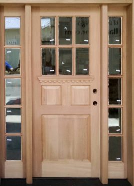 Custom farm-style Spanish cedar front door and sidelights